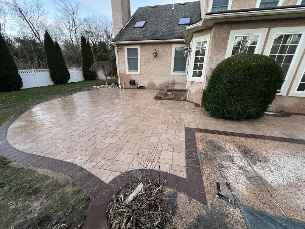 Circular paver patio with border and planting bed cutout