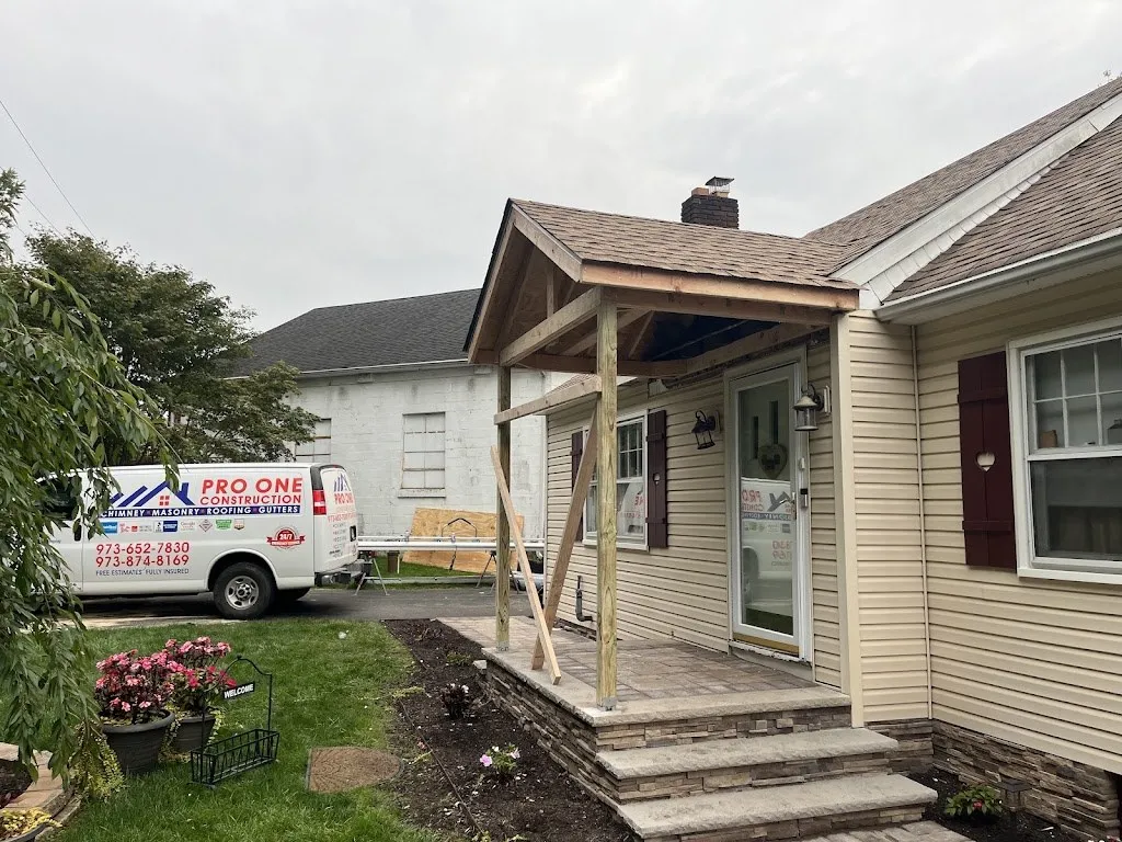New front porch roof framing during construction