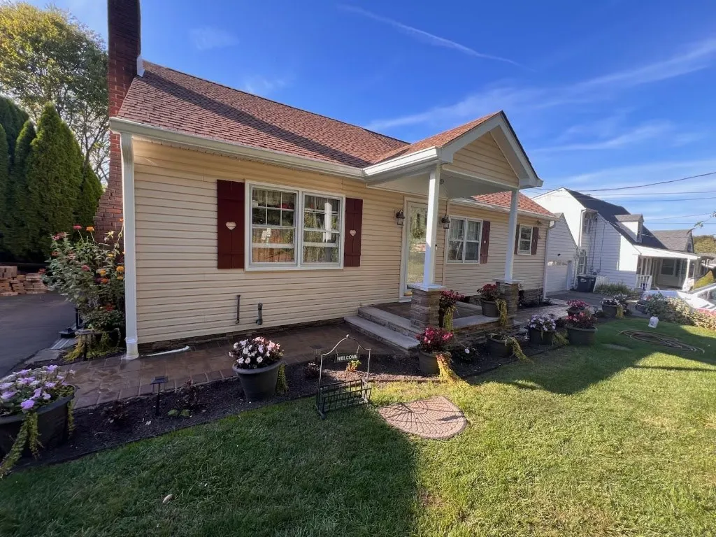 Renovated front porch and landscaping on a ranch home