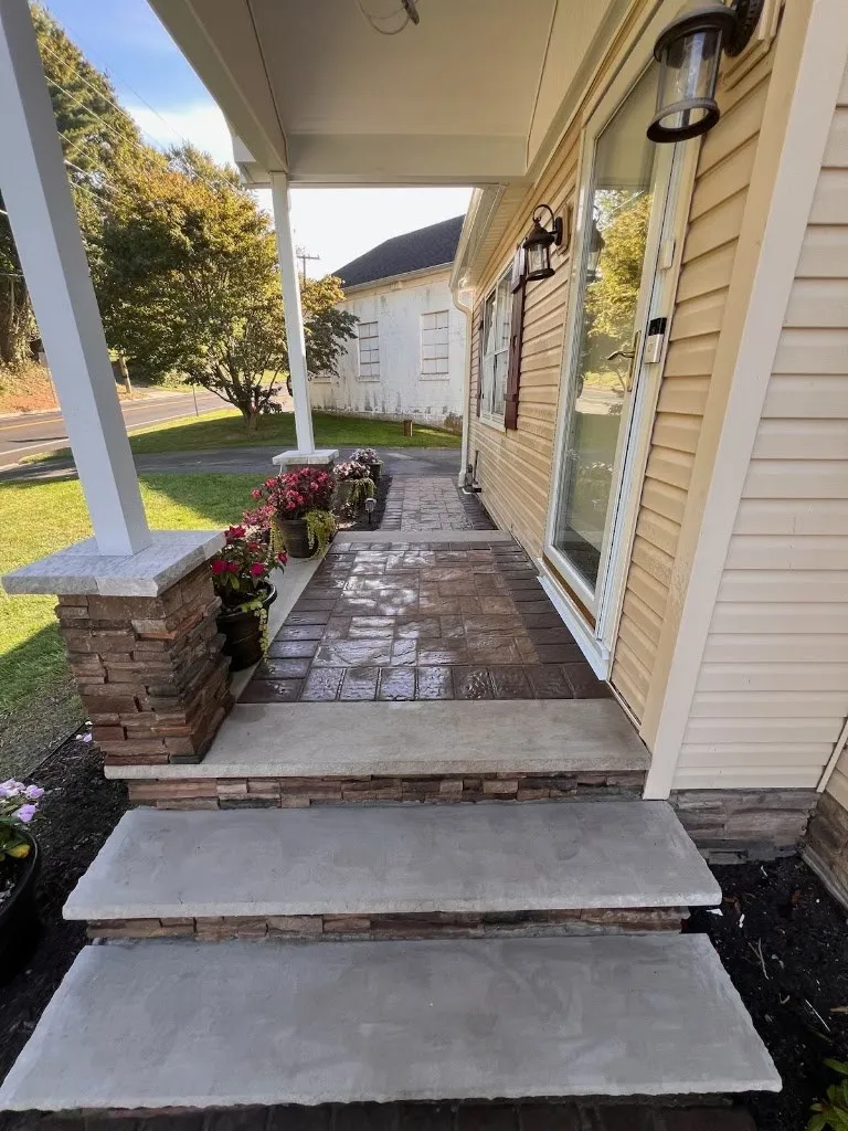 Front porch with stone column base, bluestone steps and walkway
