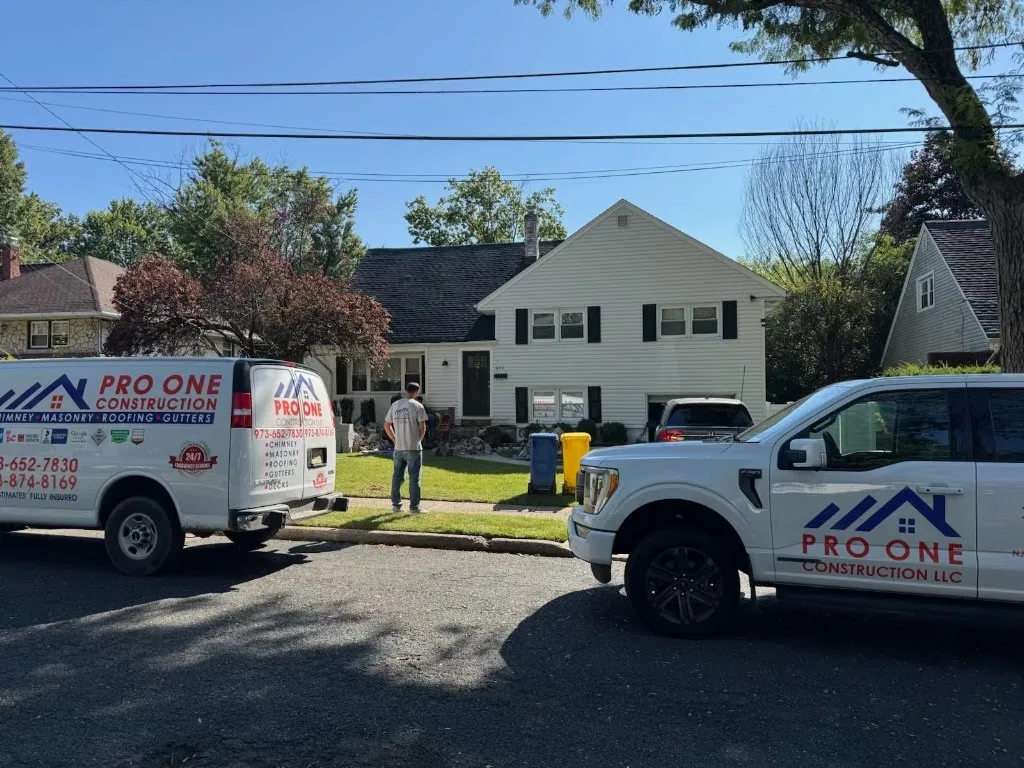 Pro One Construction van and pickup truck parked at a client's home in New Jersey